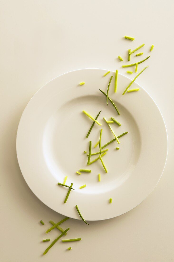 Fresh chives scattered over a plate