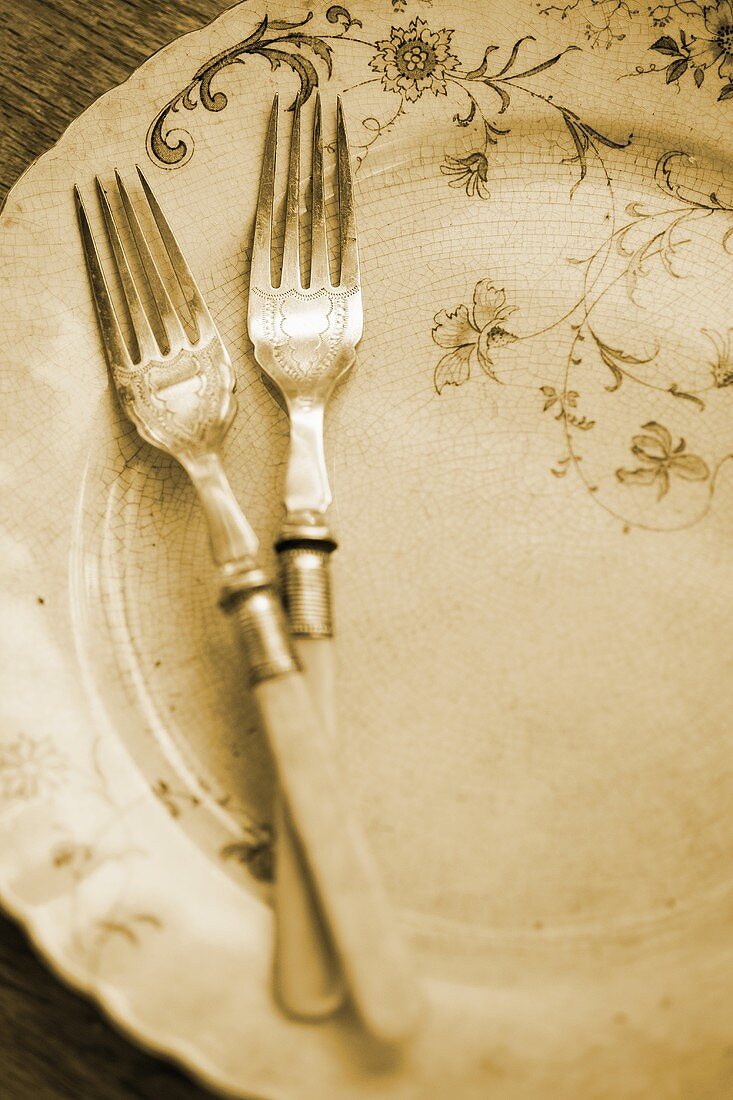 Antique plate with two forks
