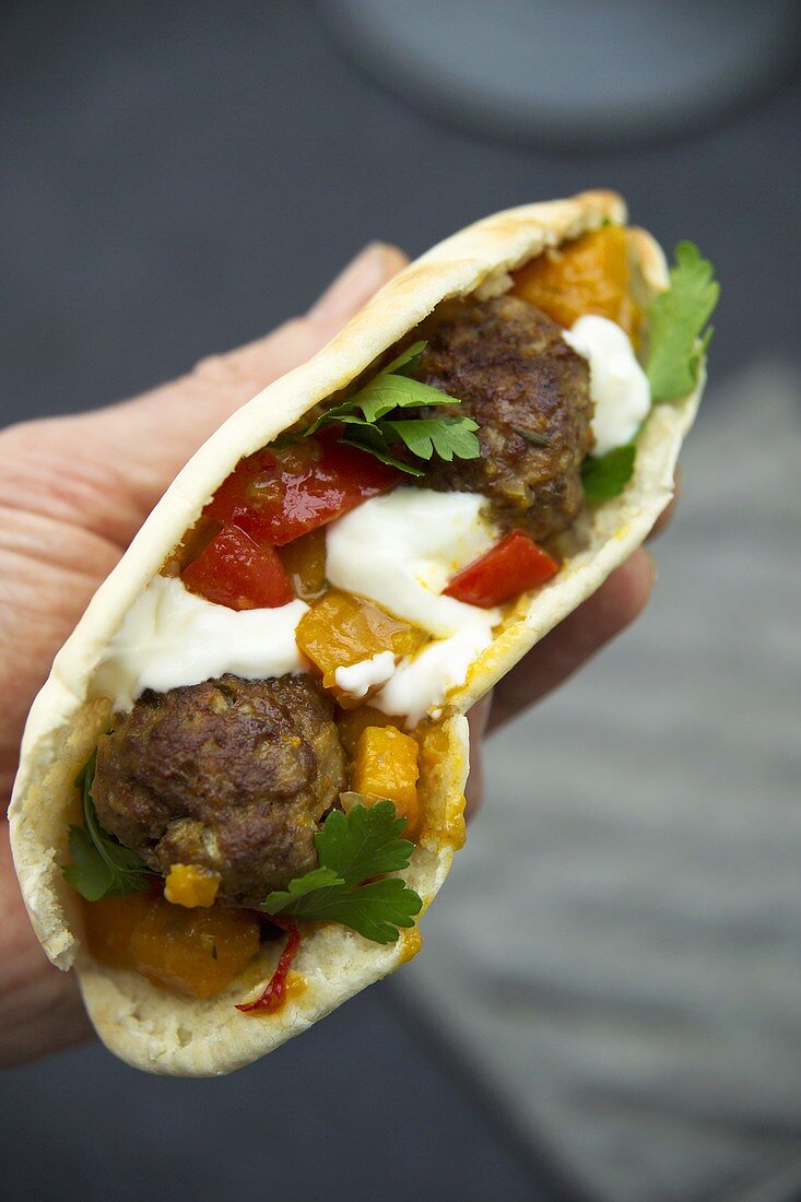 Meatballs and pumpkin in pita bread