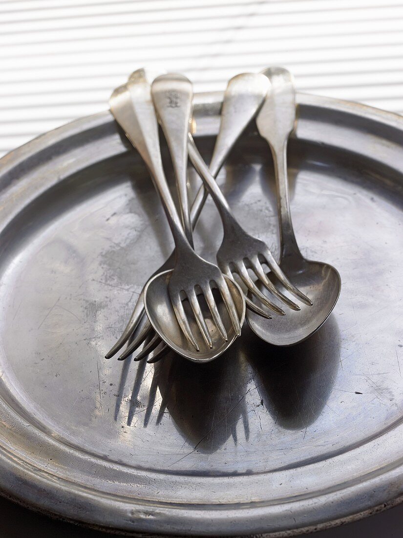 Forks and spoons on a tray