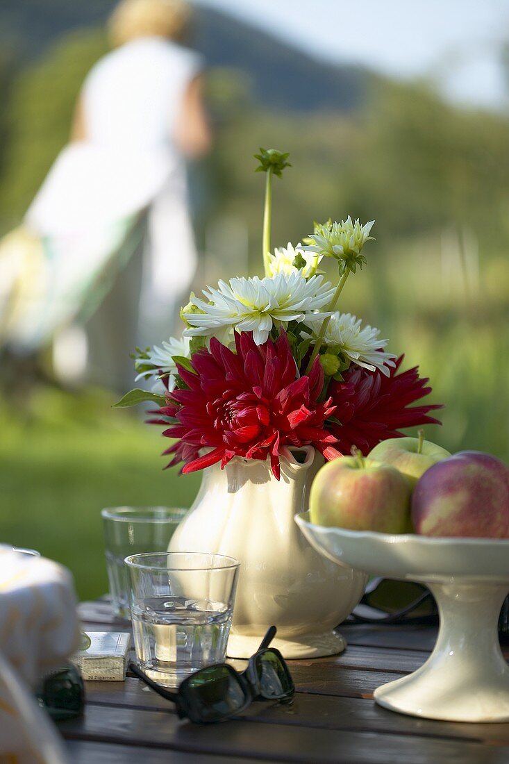 Dahlias in a china jug as table decoration