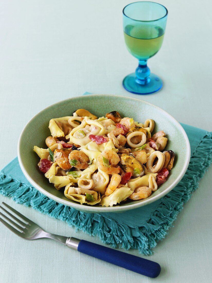 Tortellini with seafood and vegetable sauce