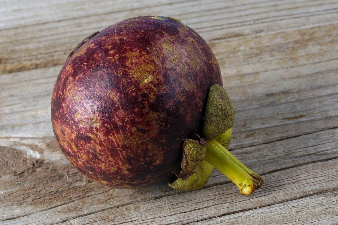 A whole mangosteen