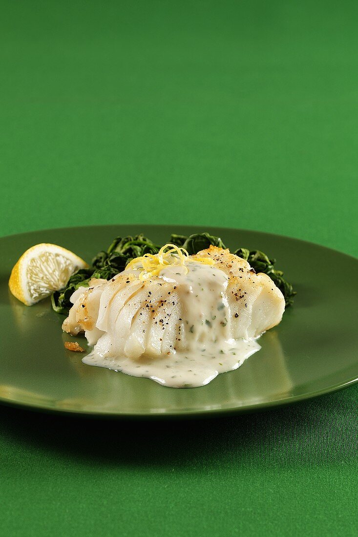 Cod fillet with spinach and herb cream sauce