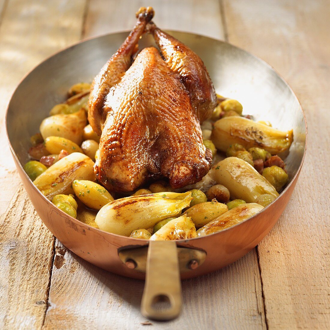 Roast chicken on chicory and Brussels sprouts