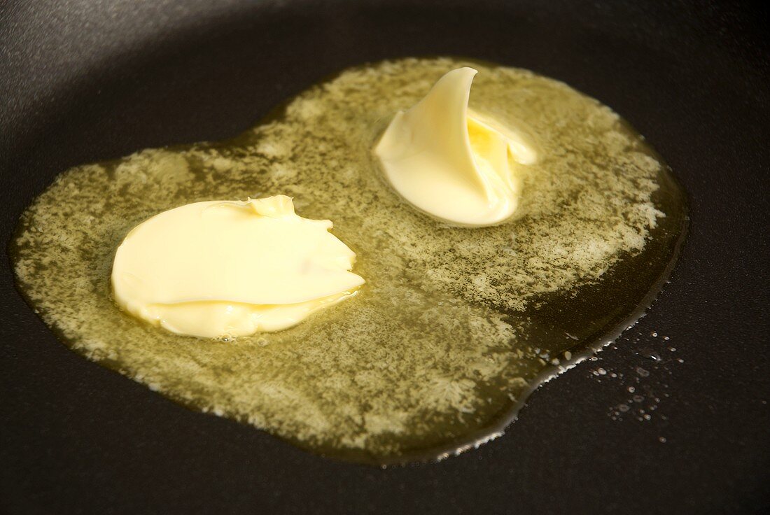 Melting butter in a frying pan