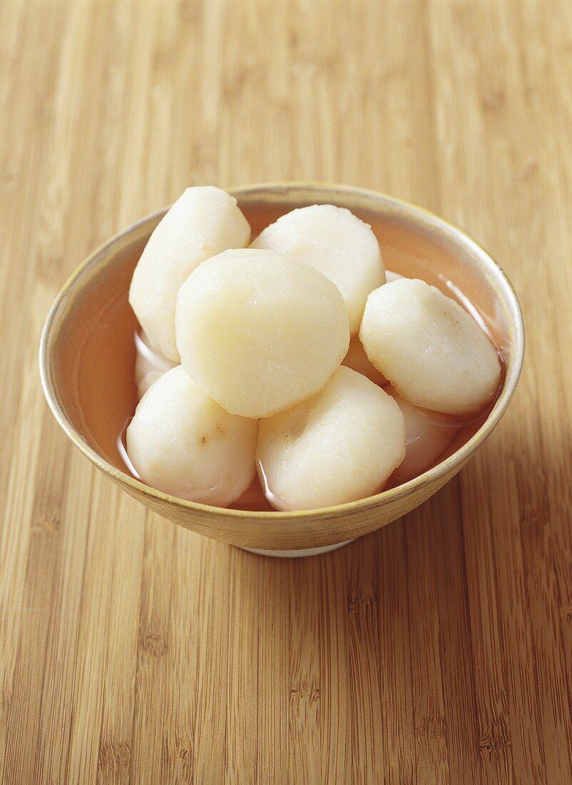 Peeled water chestnuts in a small bowl