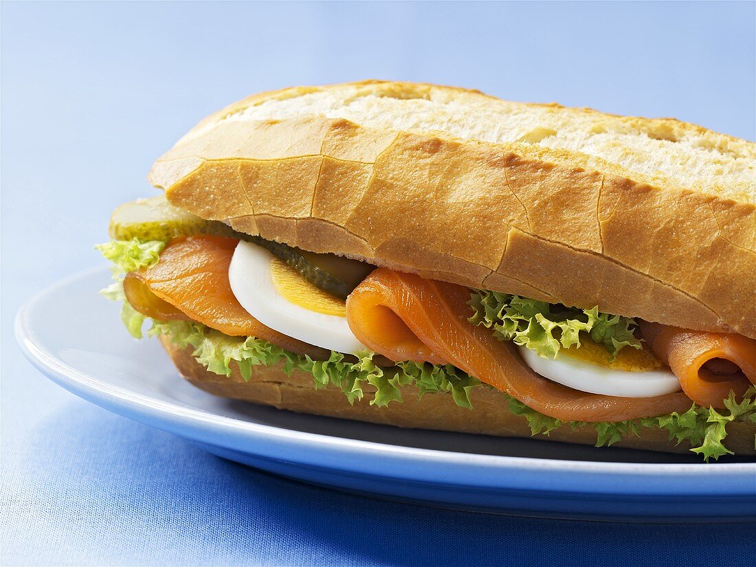 Smoked salmon and boiled egg in baguette