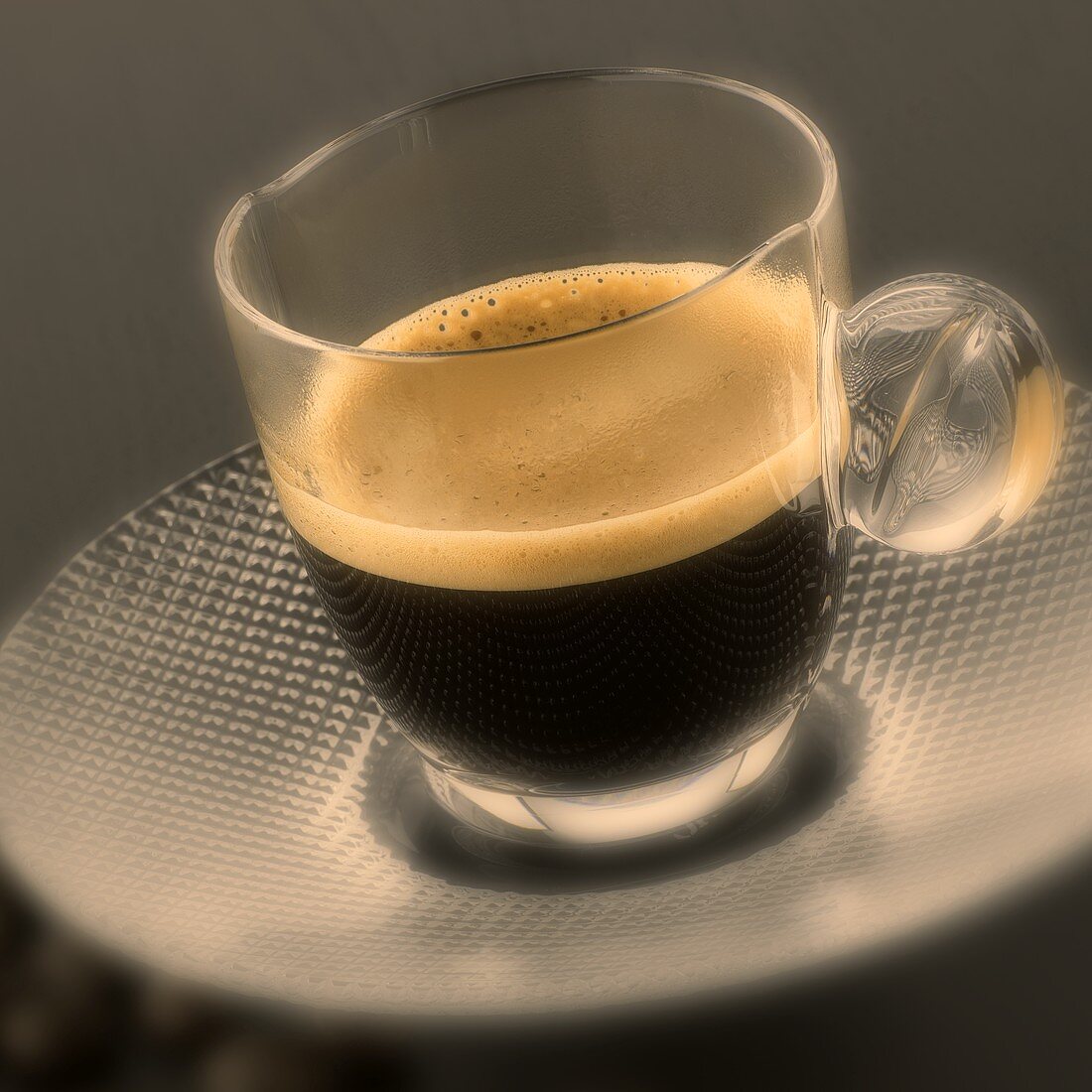 An espresso in a glass cup