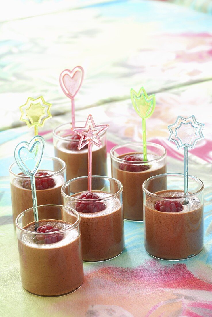 Chocolate mousse with raspberries in small glasses