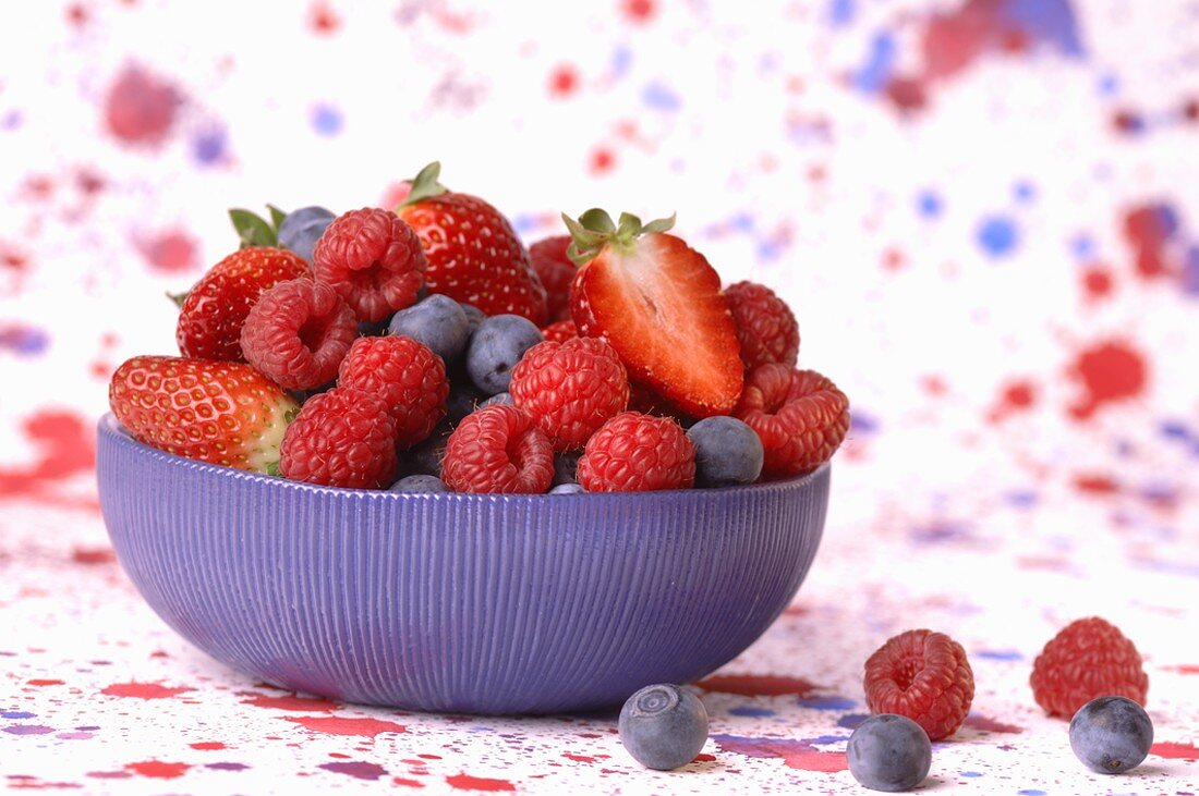 Assorted berries in blue bowl