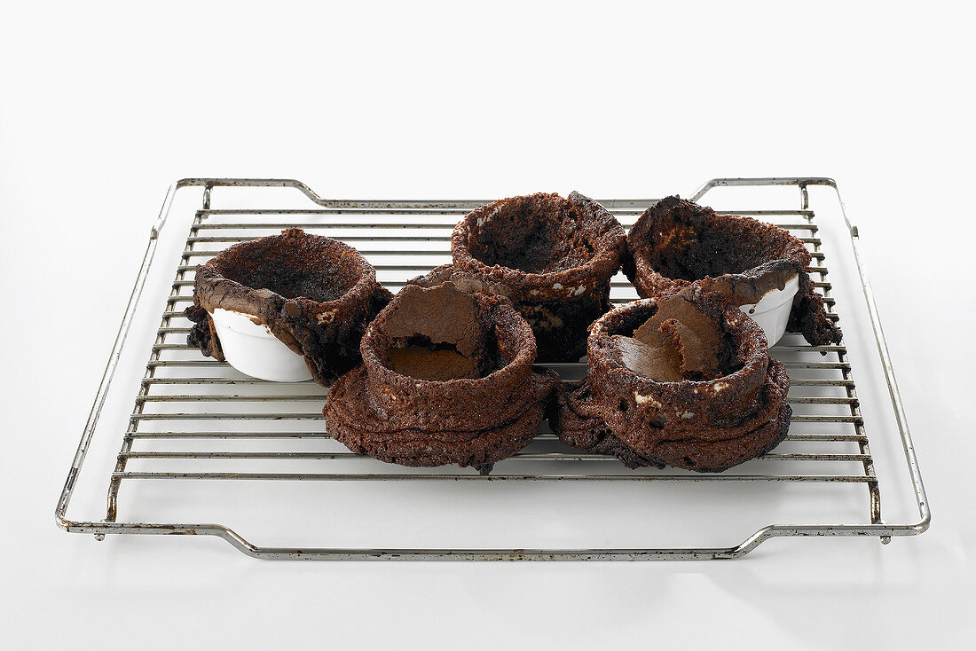 Burst chocolate soufflés on cake rack