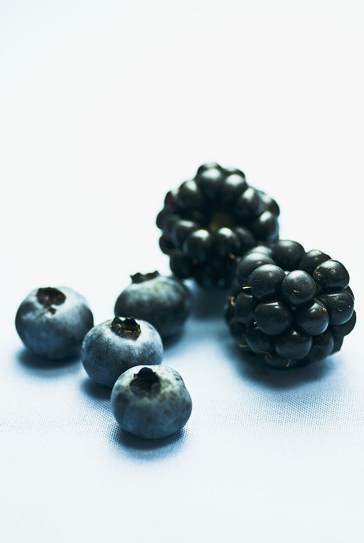 Four blueberries and two blackberries