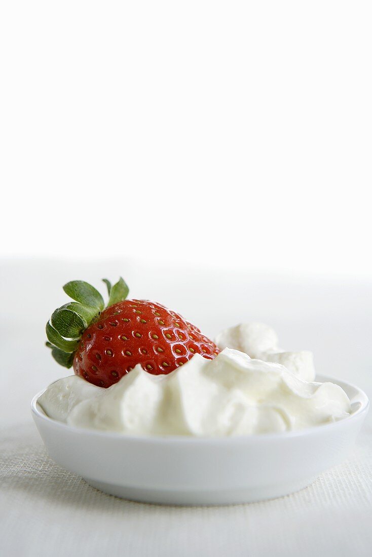 Strawberry in whipped cream