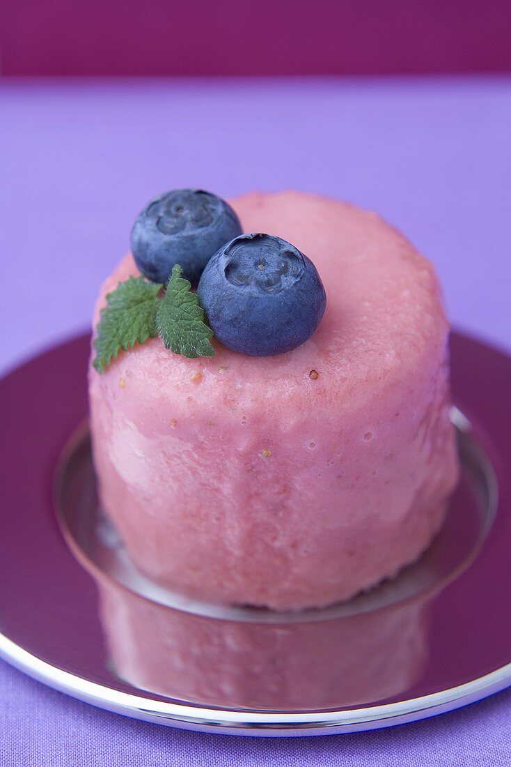 Strawberry parfait with blueberry garnish