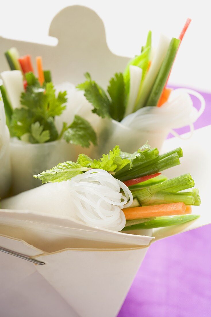 Rice paper rolls with vegetable filling in take-away container
