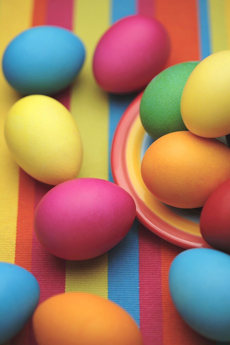 Coloured Easter eggs on striped cloth