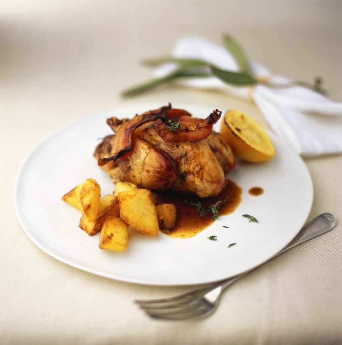 Quail with bacon and roast potatoes