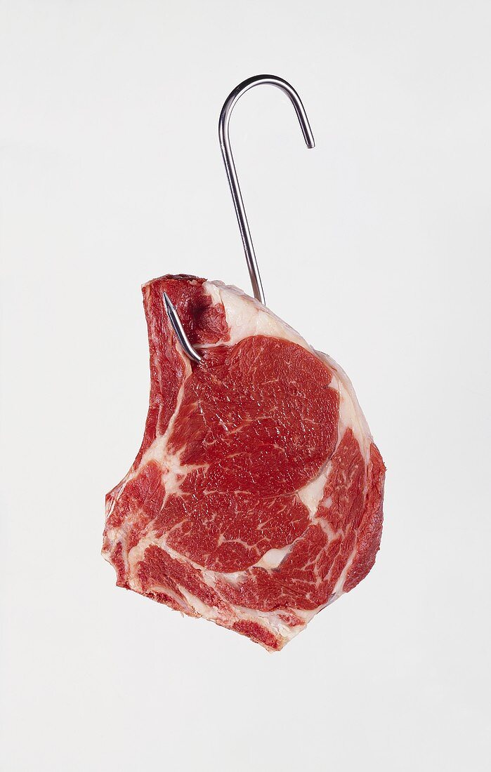 Ribeye steak on a meat hook