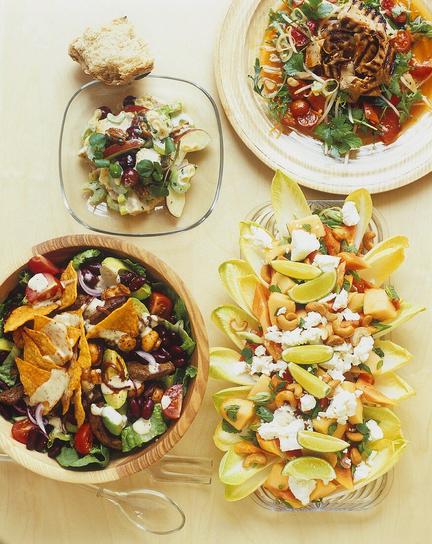 Assorted salads with beans, apples, chicken and feta