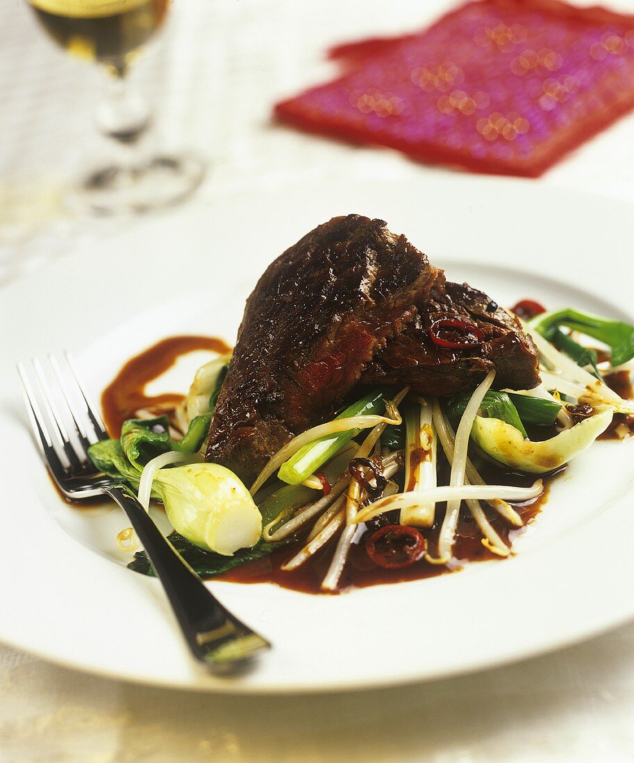 Steak with pak choi and chilli sauce