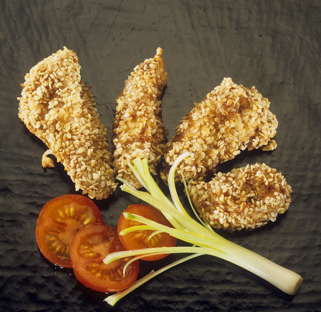 Japanese sesame chicken with tomato and spring onion