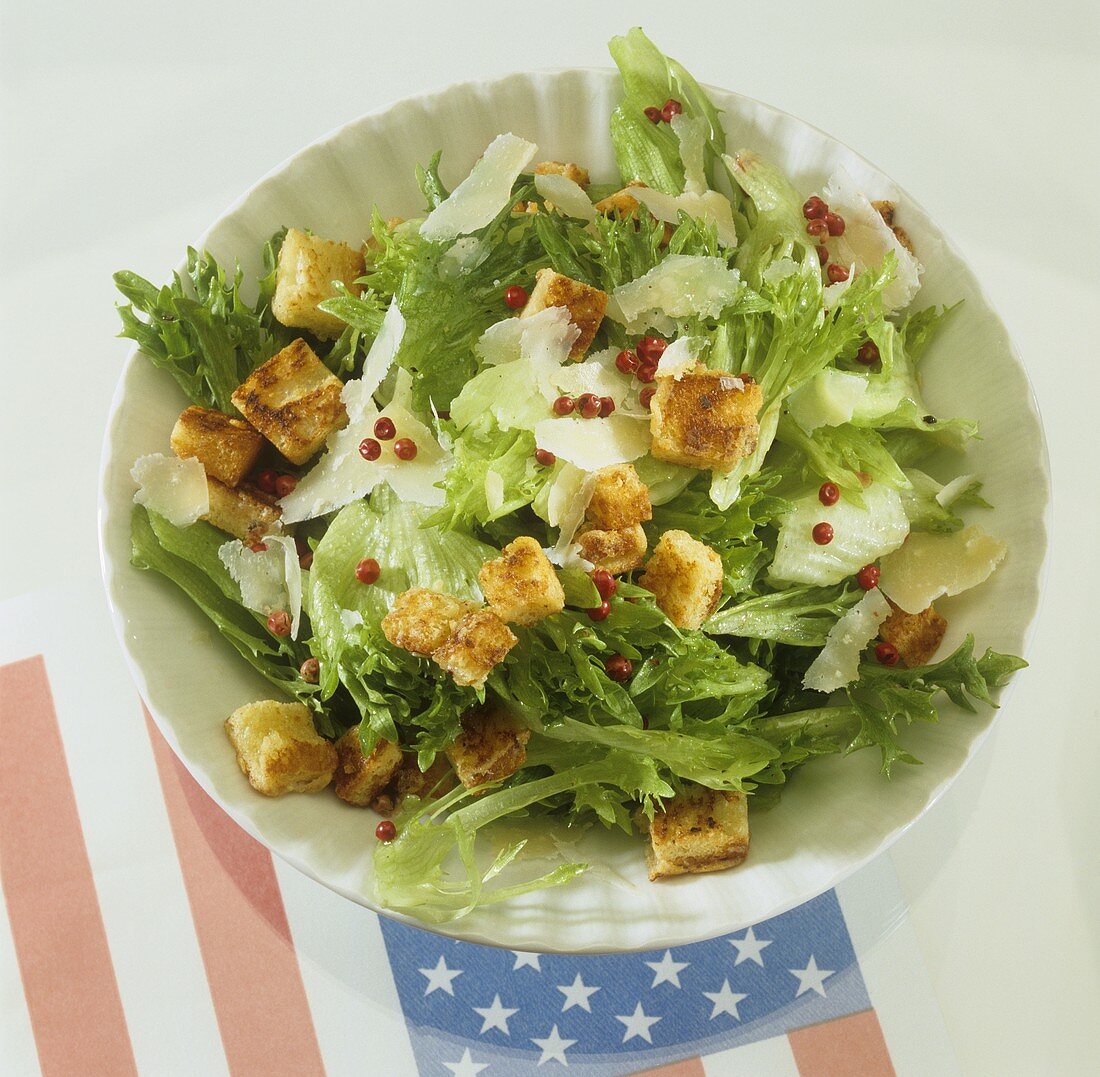 Caesar salad with croutons, Parmesan and pink peppercorns