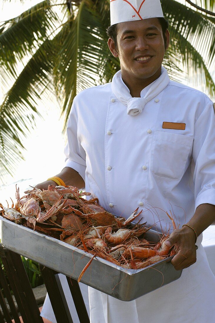 Thai chef with crabs