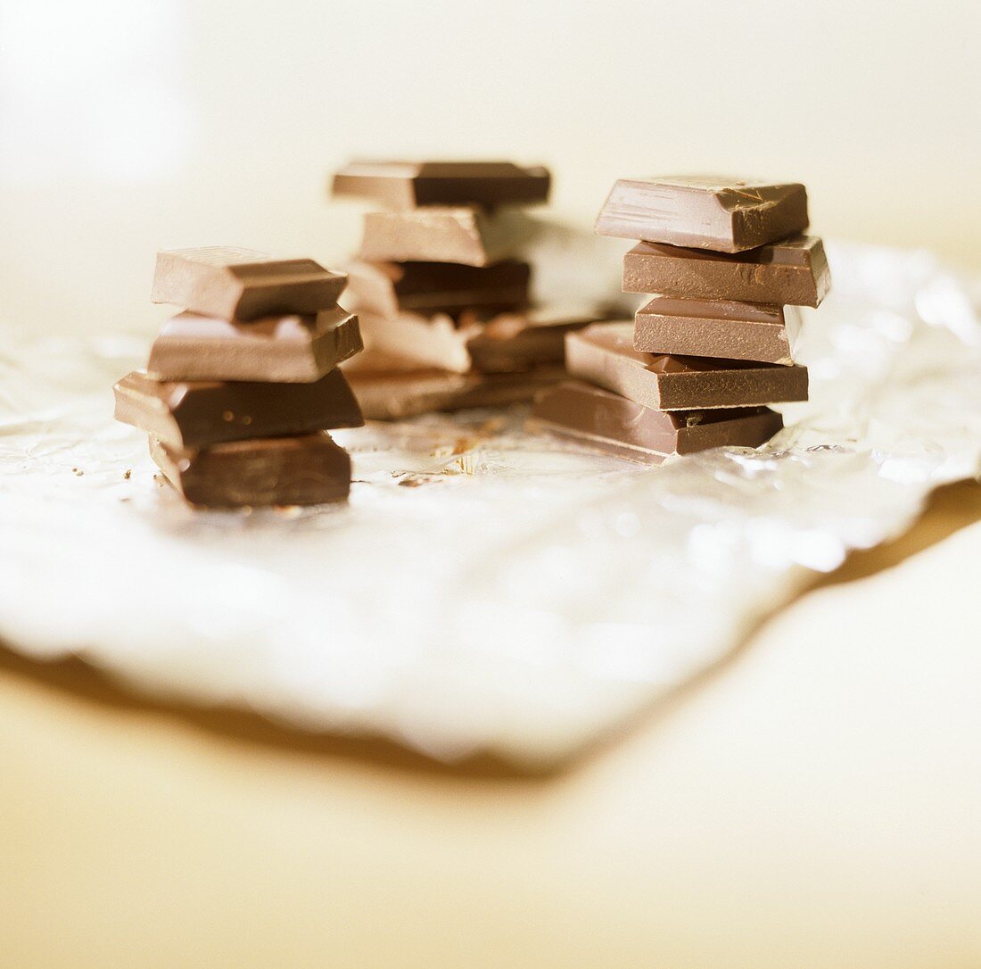 Three piles of chocolate pieces