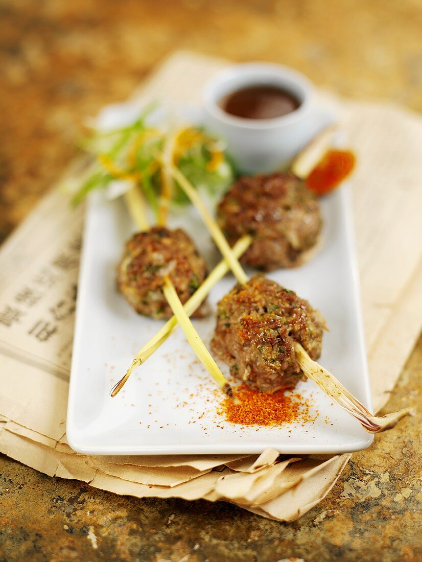 Three meatballs with lemon grass and dip