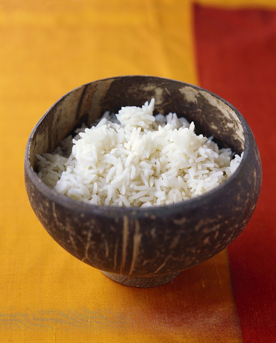 Cooked basmati rice in a wooden bowl