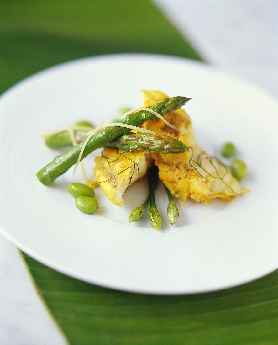 Curried cod with green asparagus