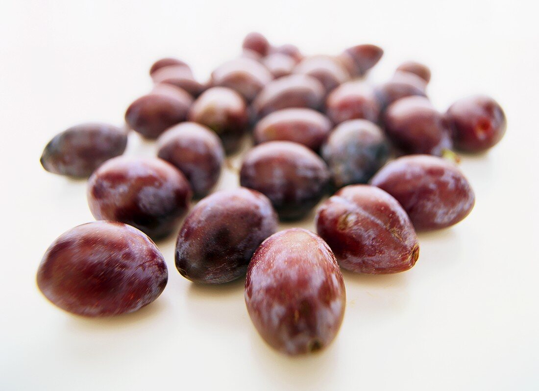 Plums on white background