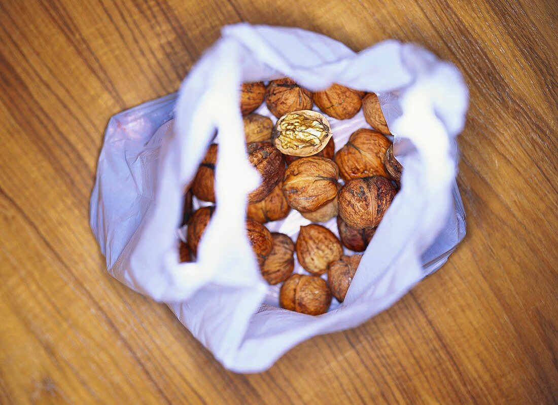 Several walnuts in a plastic bag