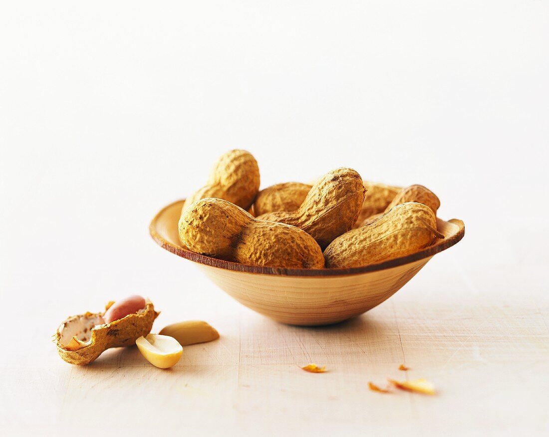 Peanuts in a turned wooden bowl