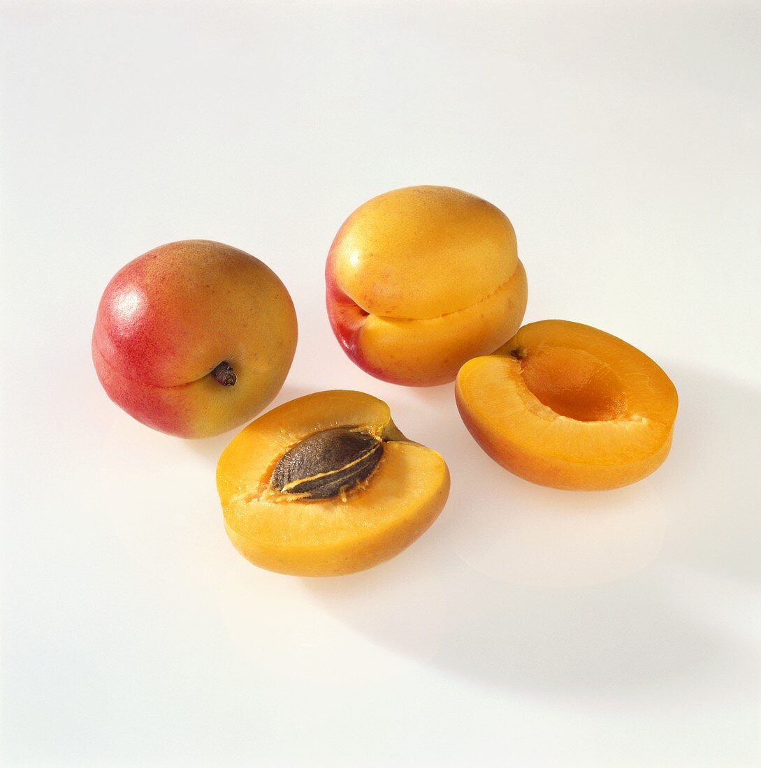 Two whole and two half apricots