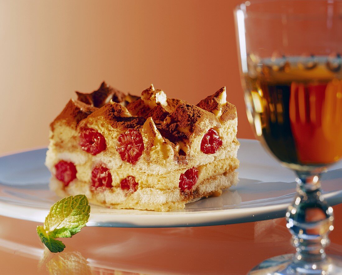 Layered dessert with sponge and raspberries, tiramisu style