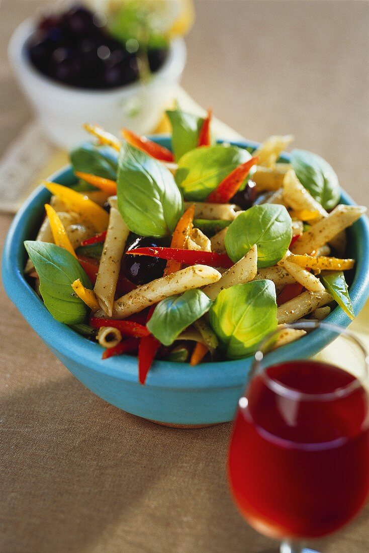 Pasta salad with peppers, olives and basil