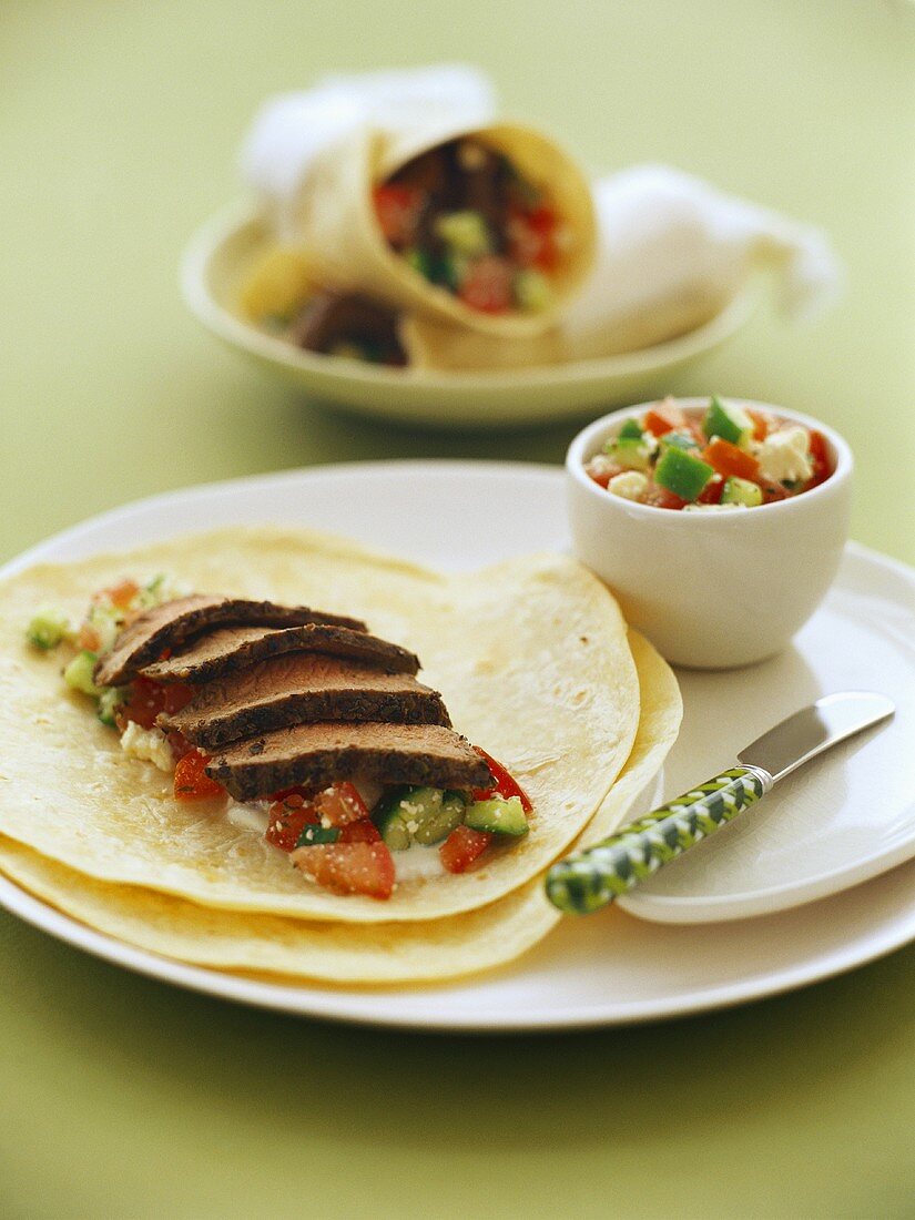 Marinated lamb on wheat tortillas