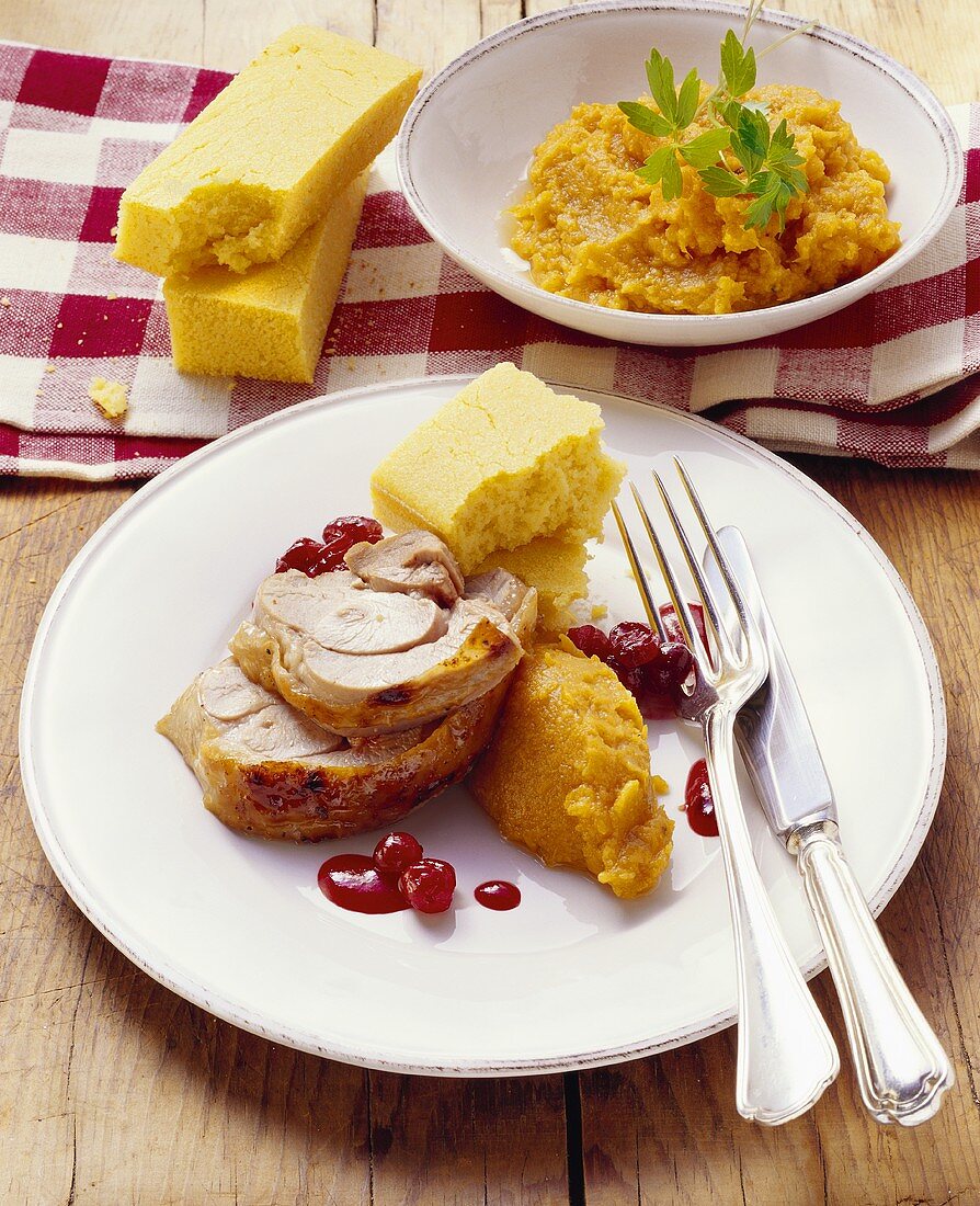 Turkey with mashed sweet potatoes, cranberries & corn bread