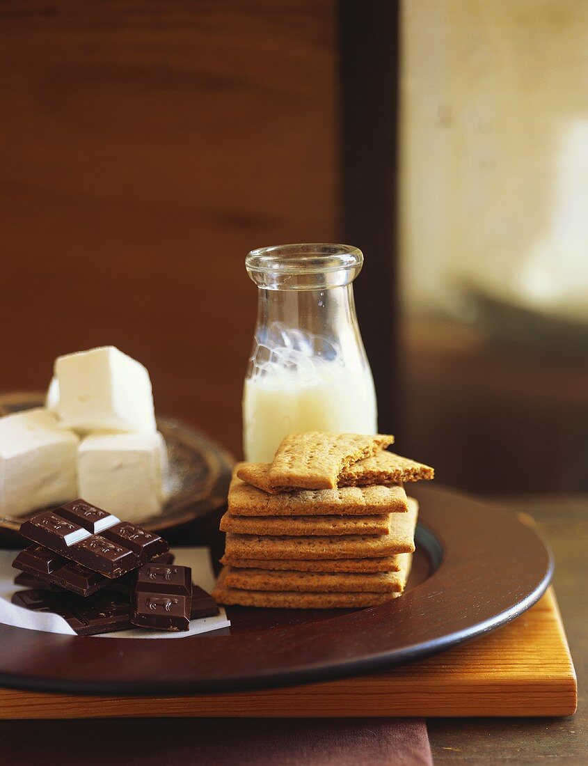 Still life with chocolate, dairy products and biscuits