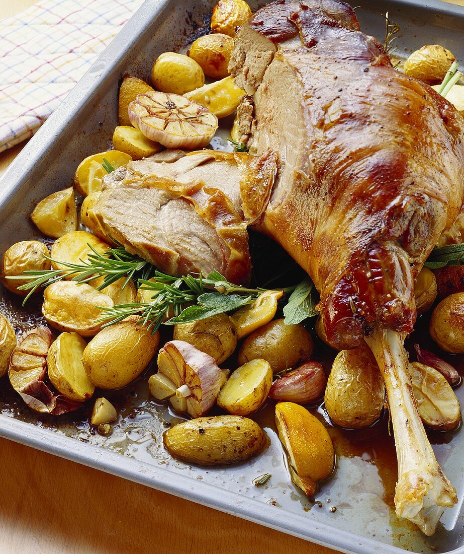 Leg of lamb with roast potatoes and rosemary