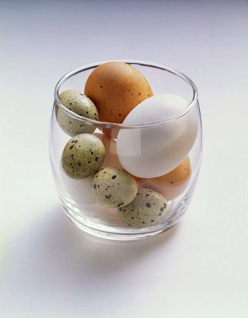 Several eggs in a glass