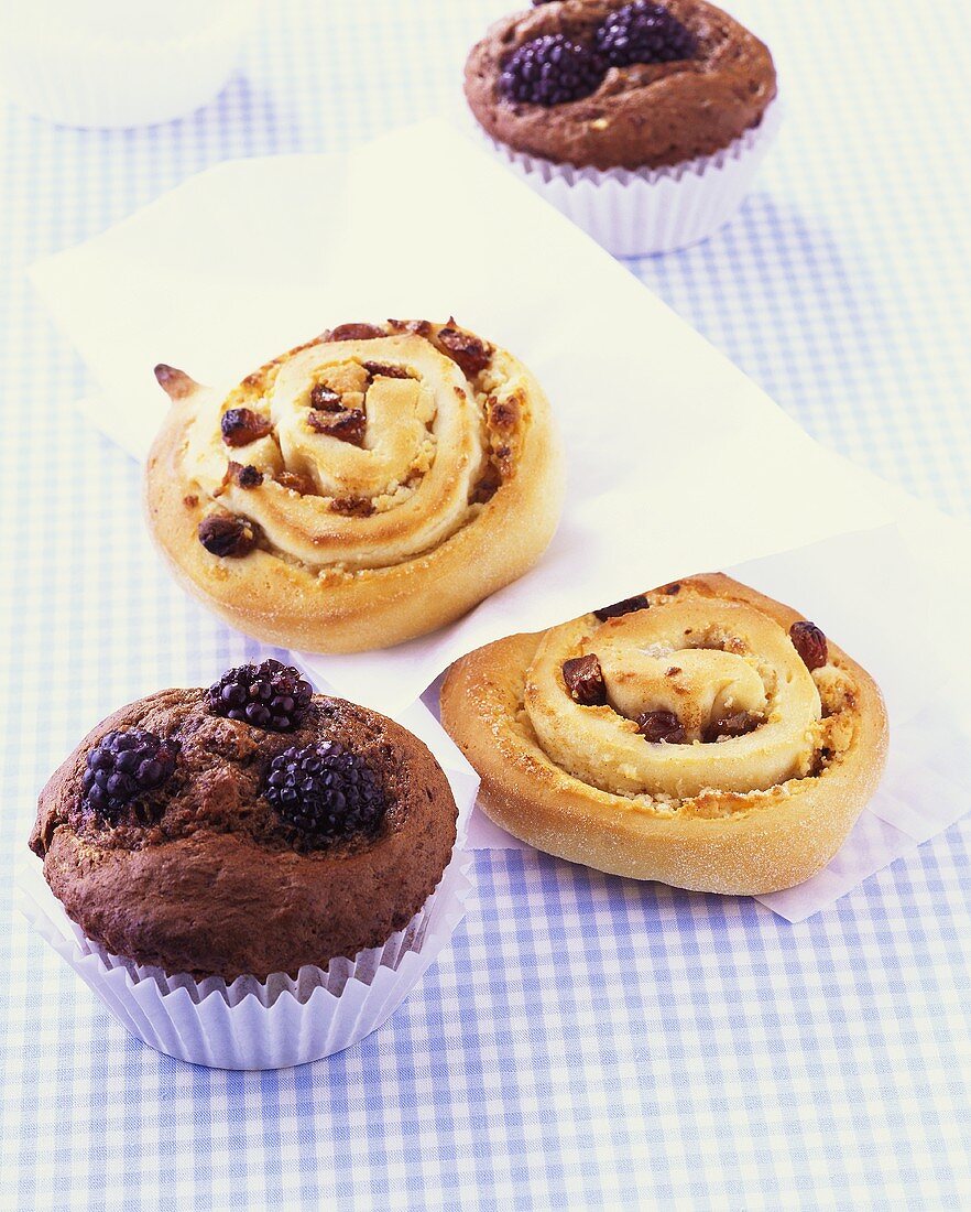 Chocolate & blackberry muffins & coiled marzipan & raisin buns