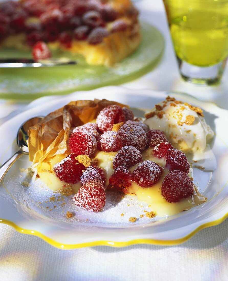 Piece of puff pastry flan with vanilla blancmange & raspberries