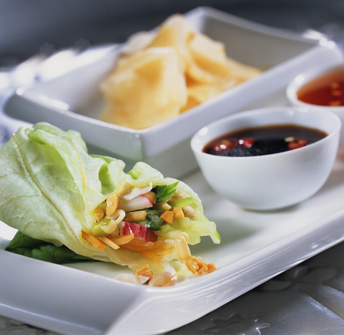 Lettuce rolls with various sauces and preserved ginger
