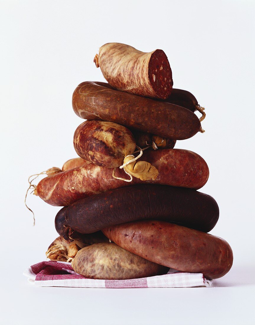 Several black puddings in a pile