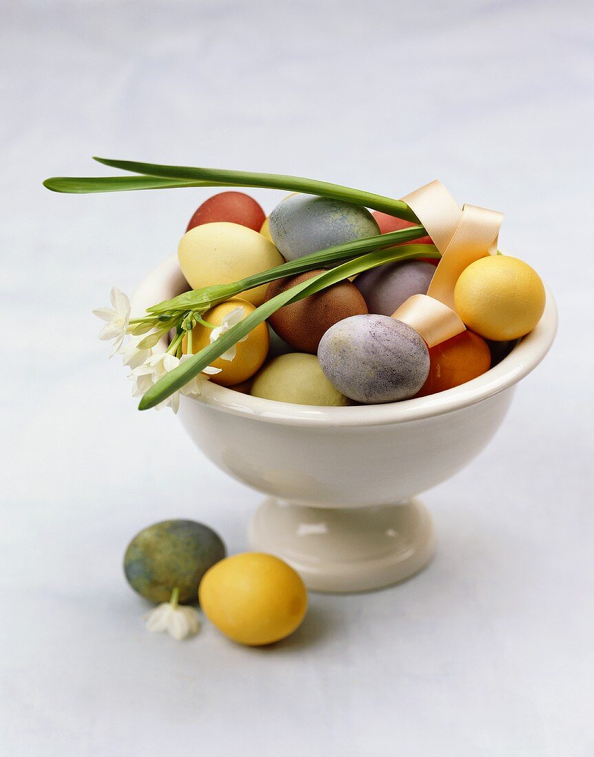 Easter eggs and snowdrops in a bowl