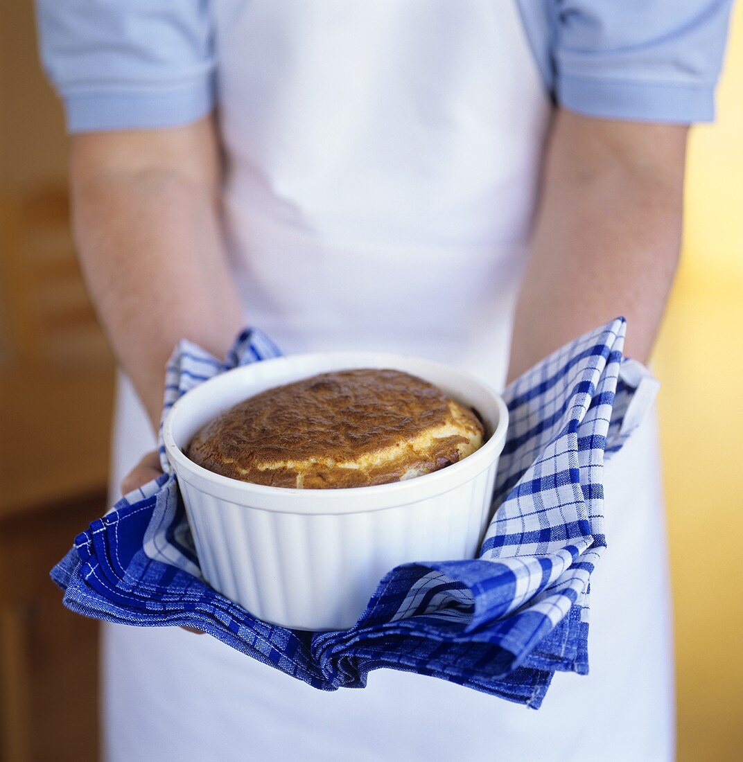 Man holding nut soufflé