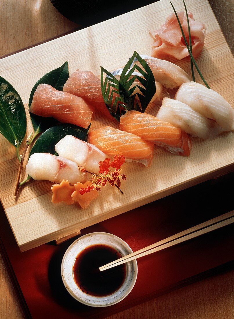 Sushi Platter with Leaves and Chopsticks